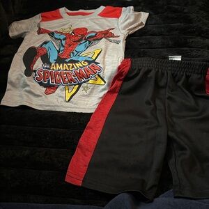 Spider-Man outfit red black blue are the colors top and shorts